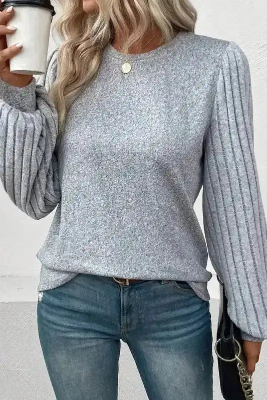 Ribbed Bishop Sleeve Top in grey with round neck and textured knit, styled casually with jeans for fall fashion.