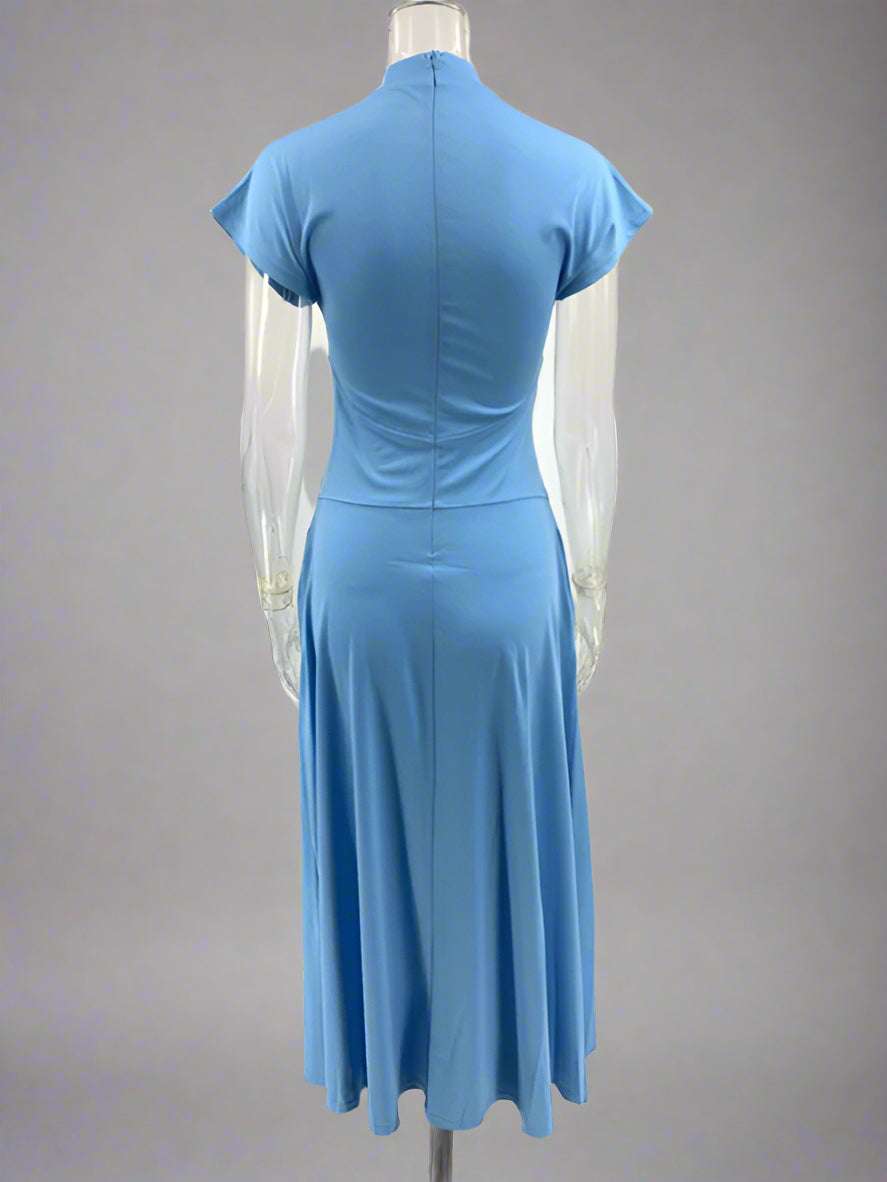 Blue dress on a mannequin against a white background