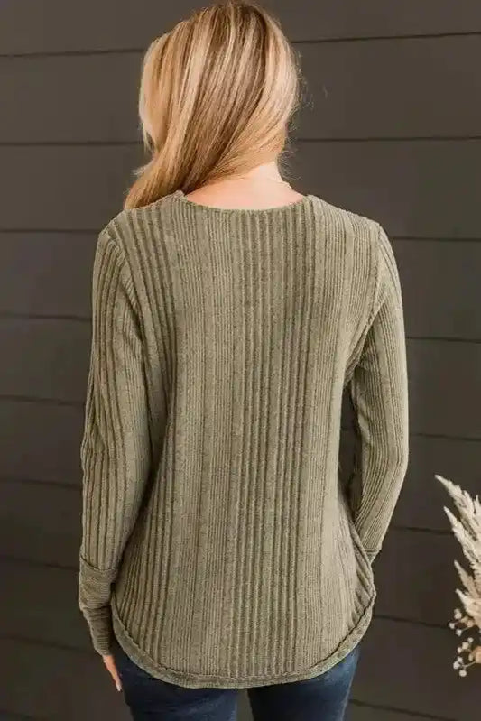 Back view of jungle green V neck buttoned ribbed knit long sleeve top showing ribbed texture and curved hem for a flattering silhouette.