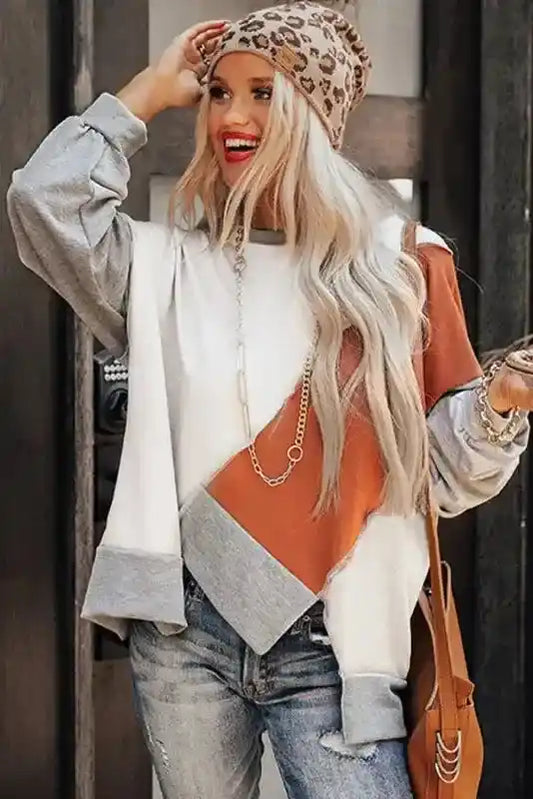 Casual Khaki Colorblock Long Sleeve Top featuring asymmetrical hem and bold color blocking, paired with leopard beanie and jeans.