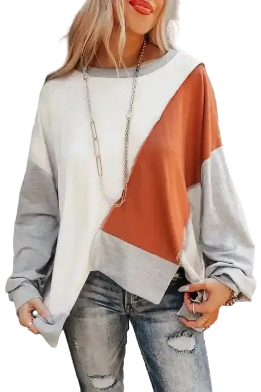Khaki Colorblock Stitching Irregular Hem Long Sleeve Top with patchwork design in white, rust, and gray, styled with distressed jeans.