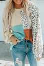 Long sleeve tops leopard patchwork color block ribbed long with crew neck and balloon sleeves, styled with distressed jeans.