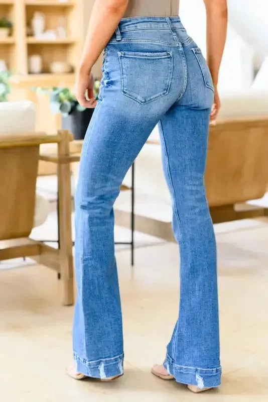 Medium wash flare jeans back view showing flared leg silhouette — Fashionfitz UK