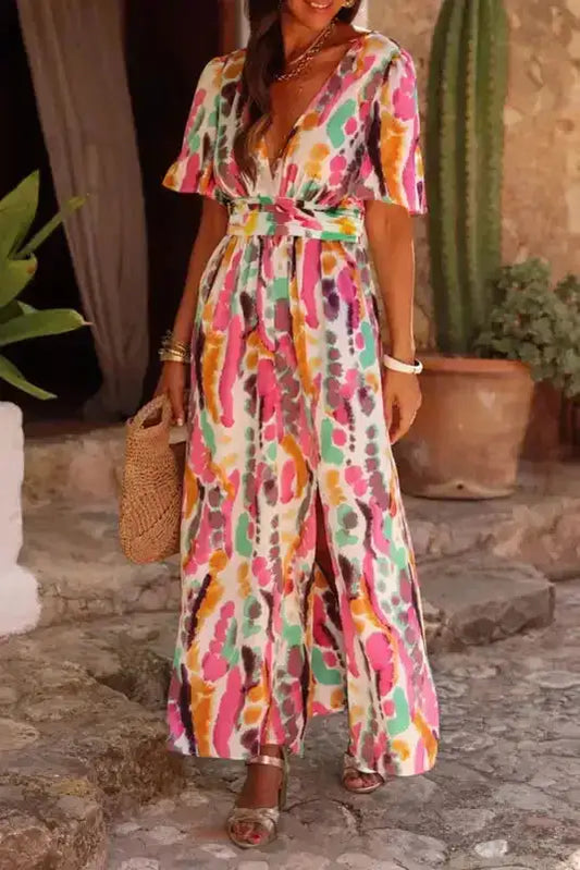 Pink boho tie-dye maxi dress with V-neck and short sleeves, featuring a colorful A-line silhouette perfect for summer vacations or festivals.