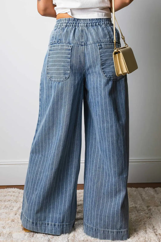 Back view of pinstripe wide leg jeans for women featuring elastic waistband and large patch pockets, perfect for off-duty styling.