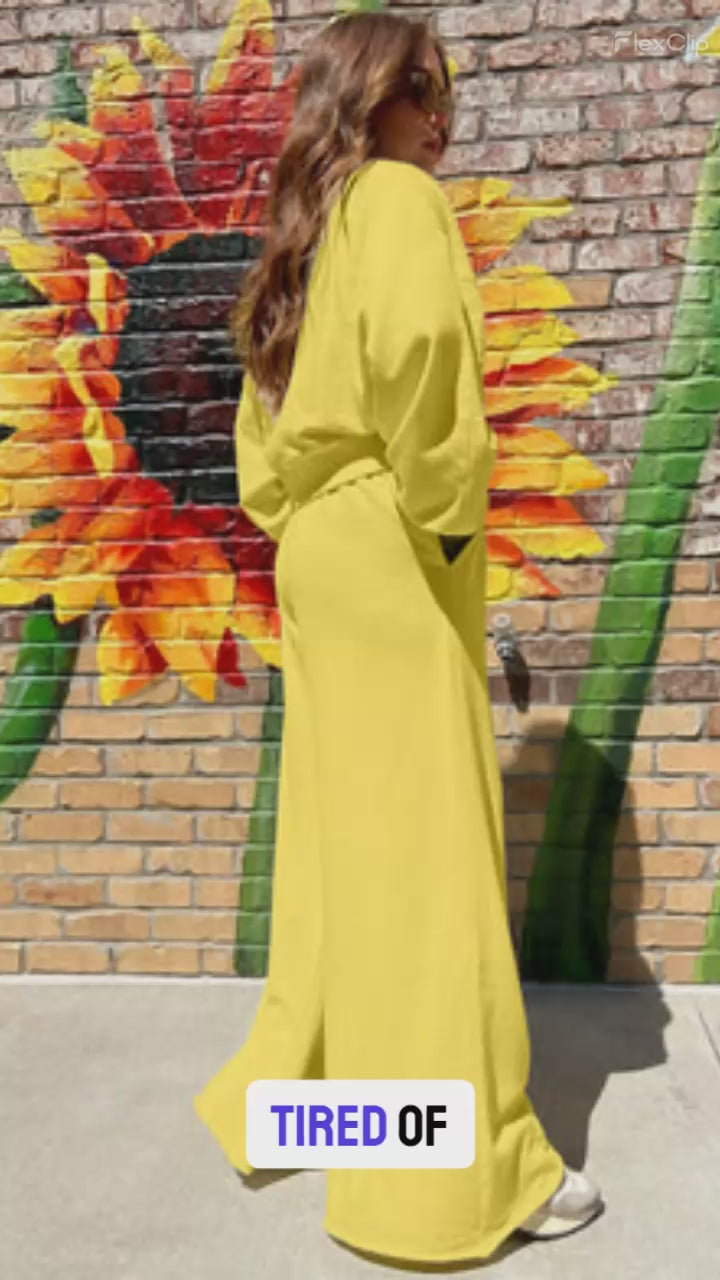 Drop Crop Wide-Leg Pants Set in yellow styled outdoors with sunflower mural, showcasing casual loungewear silhouette for fall fashion.