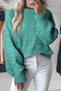 Sea Green Cable Knit Sleeve Drop Shoulder Sweater with long sleeves and textured knit pattern, styled with white jeans for a cozy winter look.