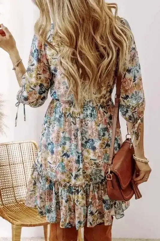 Floral smocked V-neck mini dress back view — Fashionfitz UK
