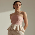 Peplum tops UK 2026 — high fashion editorial feminine silhouette