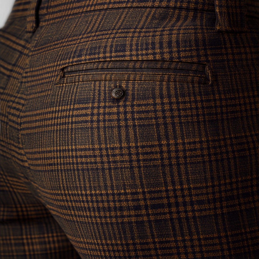 Checked trousers UK 2026 — tartan plaid fashion editorial Canva image