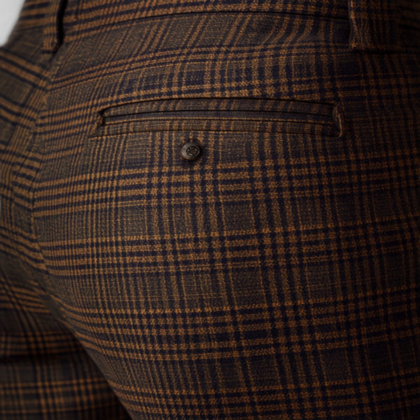 Checked trousers UK 2026 — tartan plaid fashion editorial Canva image