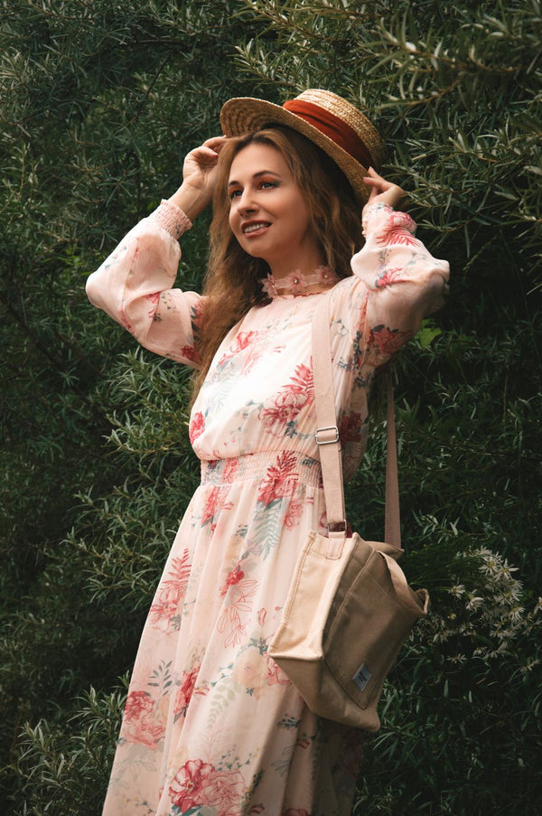 Woman in swimwear cover-up dress with straw hat holiday UK 2026