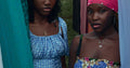 Two women in vibrant colourful dresses outdoors - neon fashion trends 2026