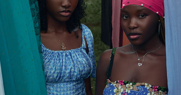 Two women in vibrant colourful dresses outdoors - neon fashion trends 2026
