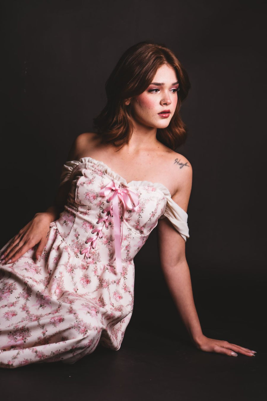 Woman in off shoulder dress romantic neckline summer 2026