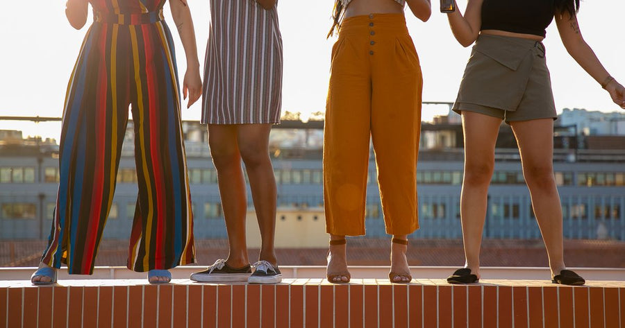 Women friends in stylish summer clothes at rooftop bank holiday gathering 2026