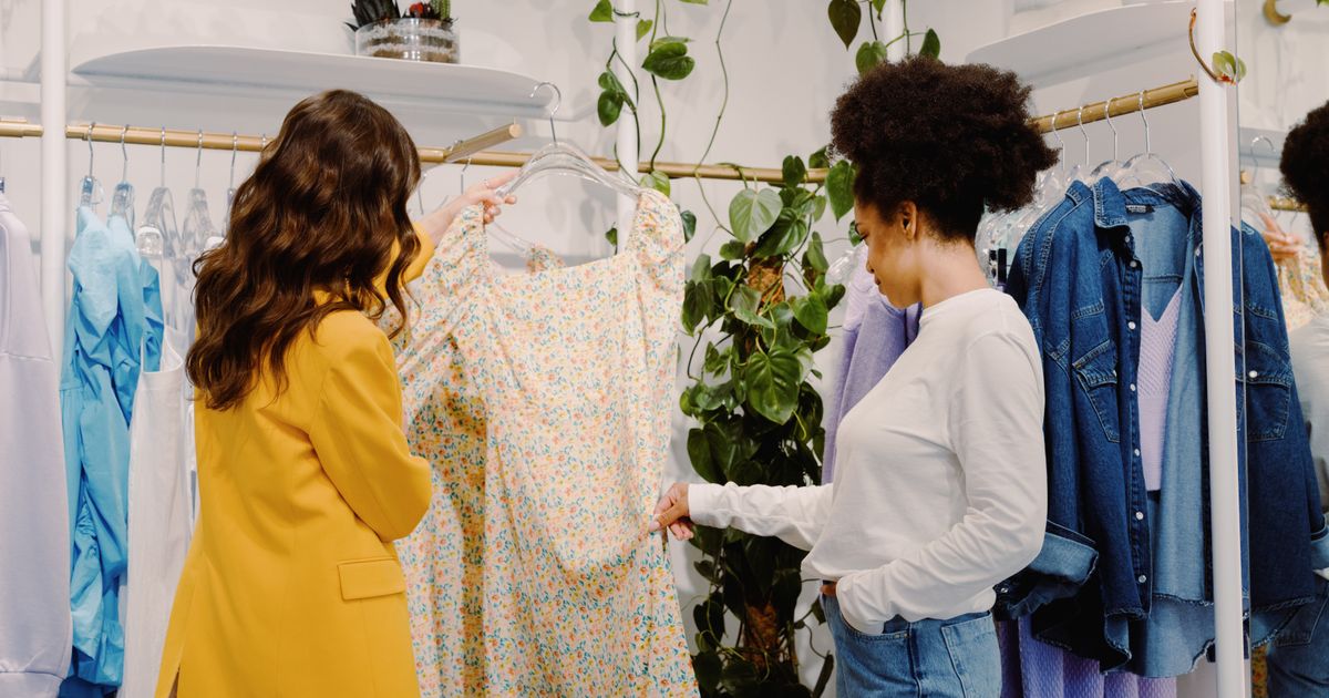 Two women shopping for summer fashion in stylish boutique - summer sale edit 2026
