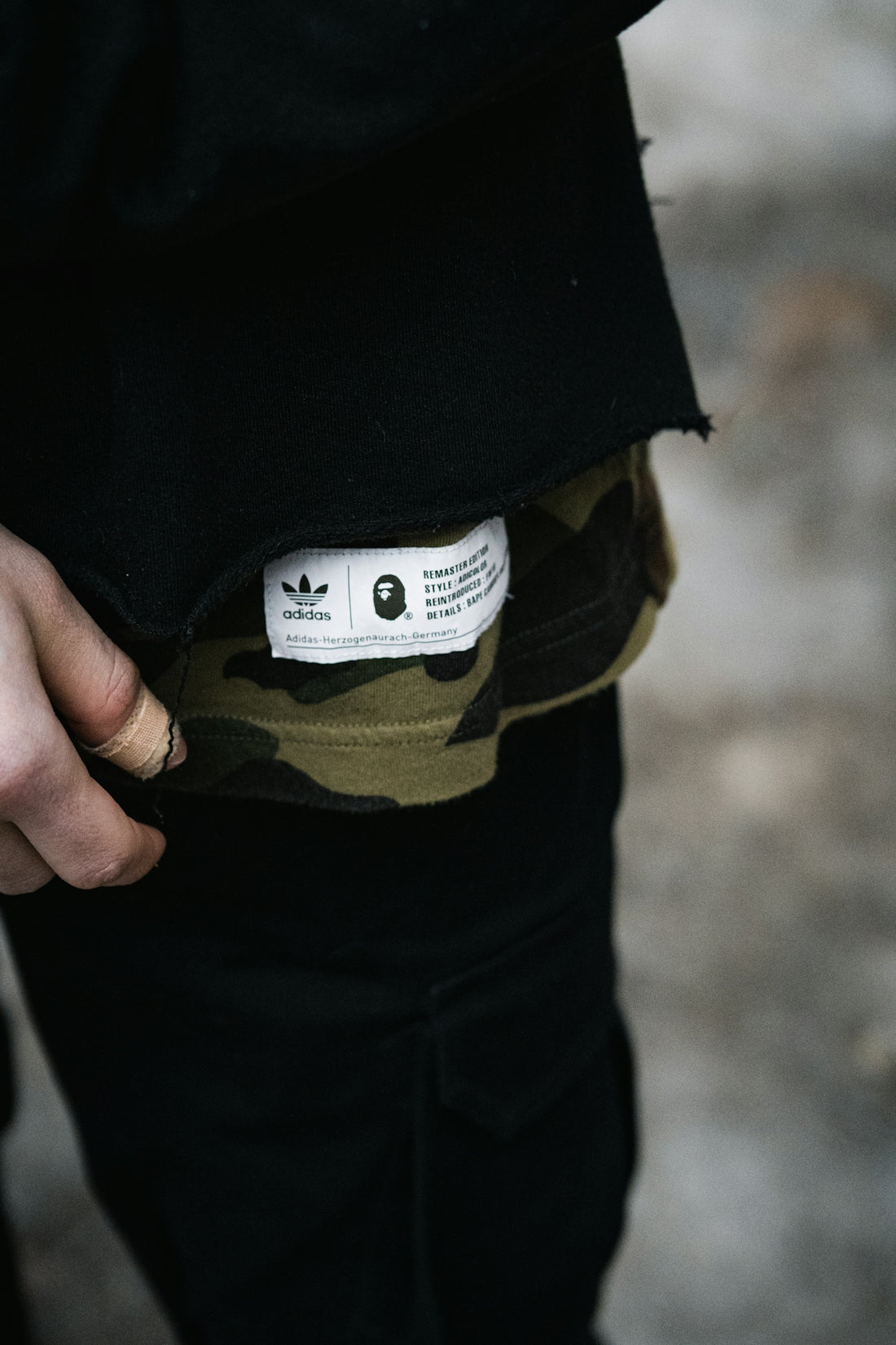 person in black shirt and brown pants