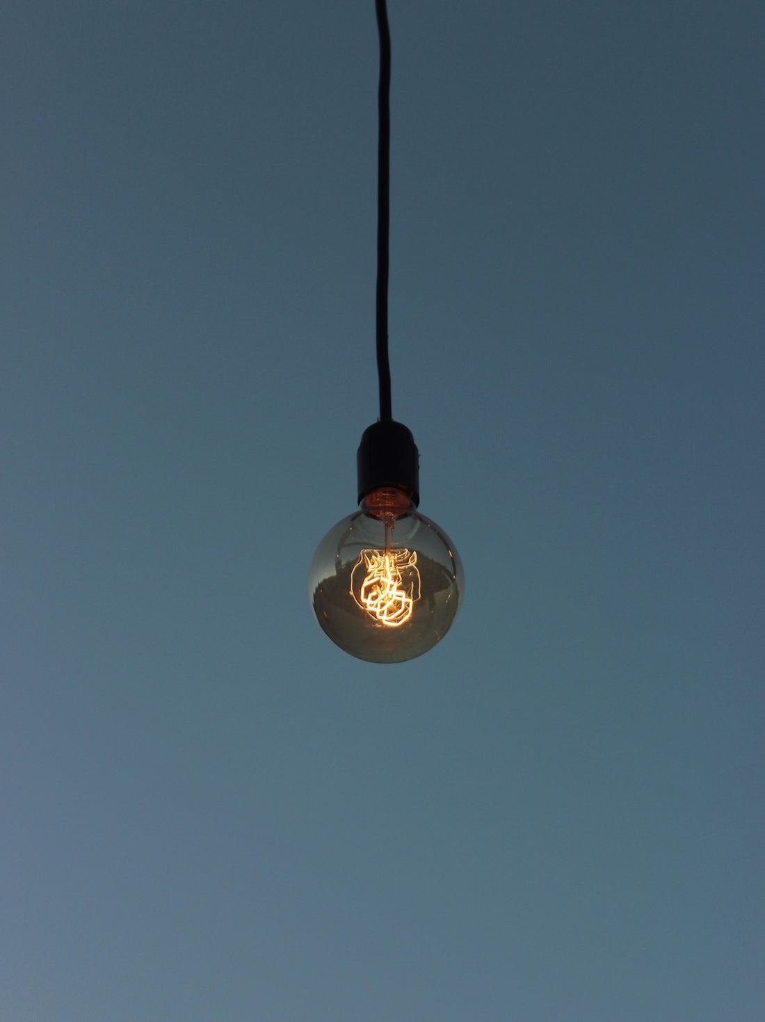 white light bulb turned on during night time