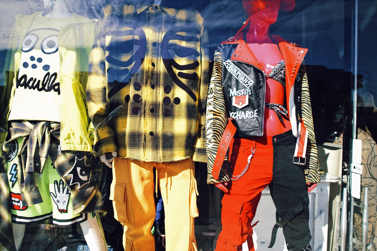 man in black and white plaid button up shirt and orange pants