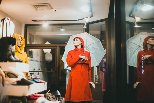 woman in red robe holding umbrella