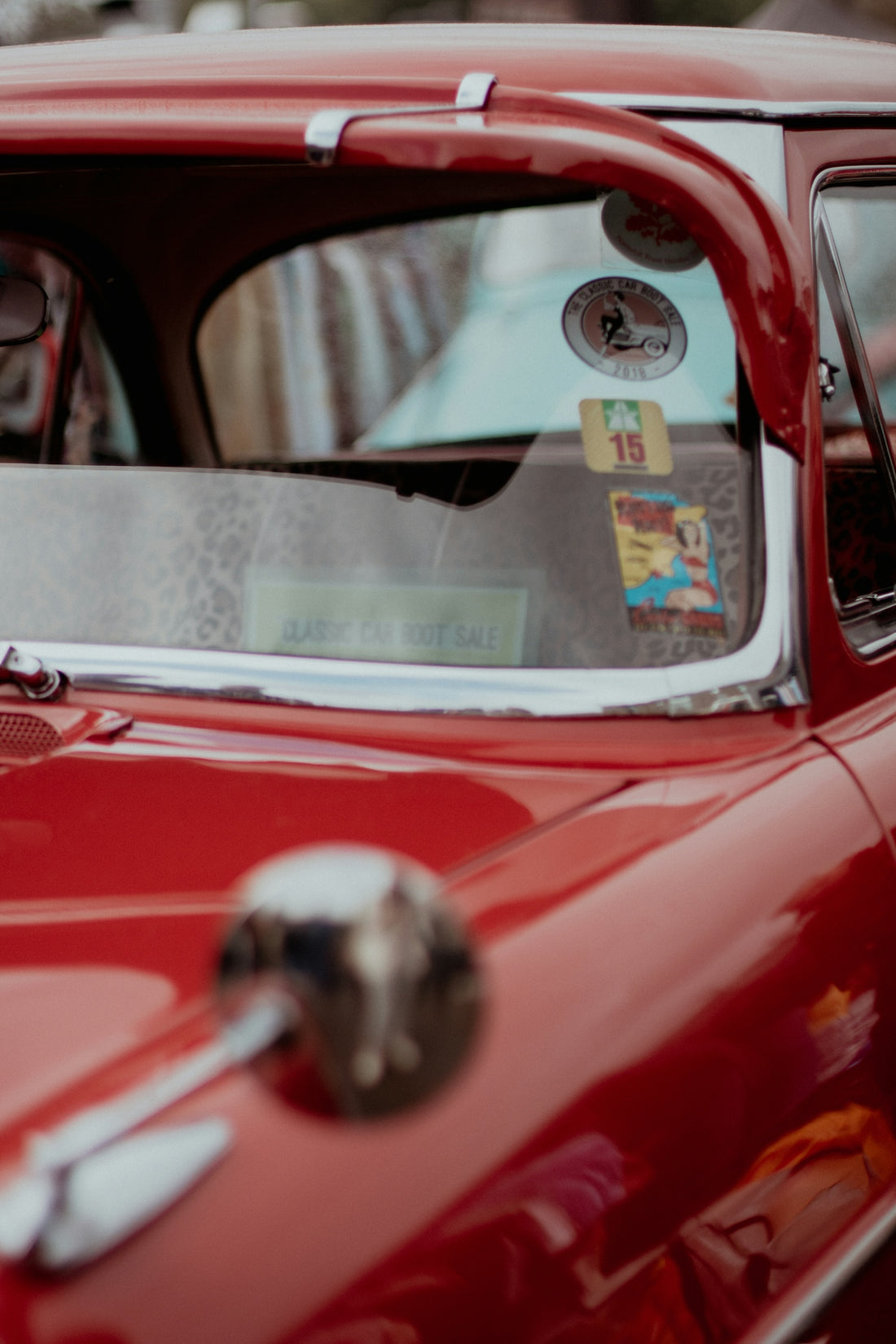 a close up of the front of a red car
