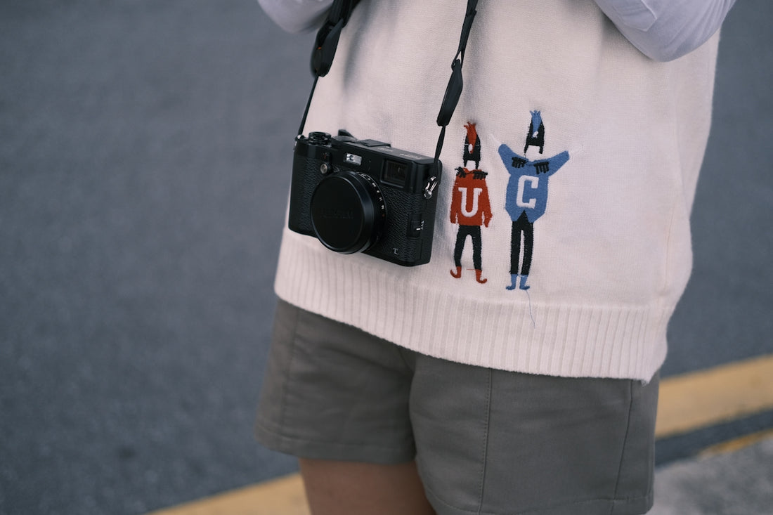 a person holding a camera and taking a picture