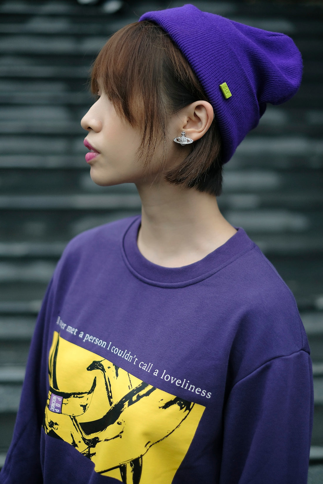 a person wearing a purple hat and a purple shirt
