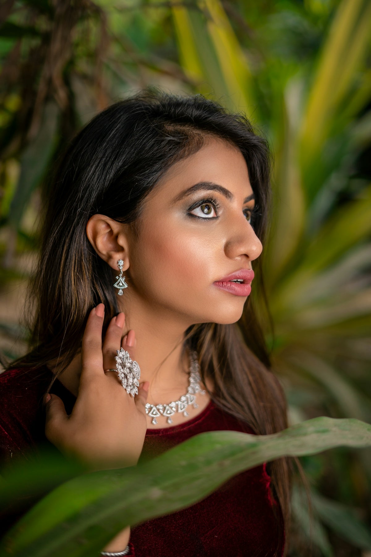 A woman in a red dress is posing for a picture