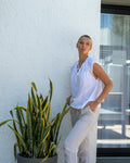 Woman in wide leg linen trousers and white top — Fashionfitz UK trouser trend summer 2026