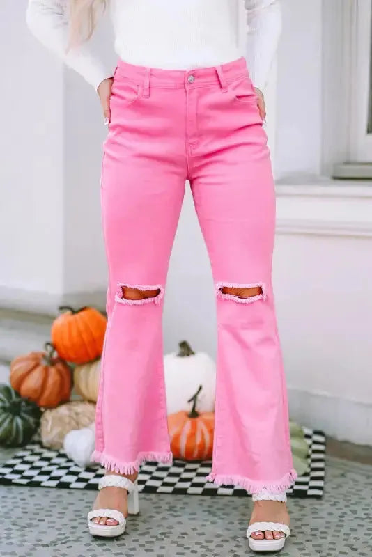 How to style flare jeans women UK 2026 — pink high waist flare leg raw hem jeans | Fashionfitz