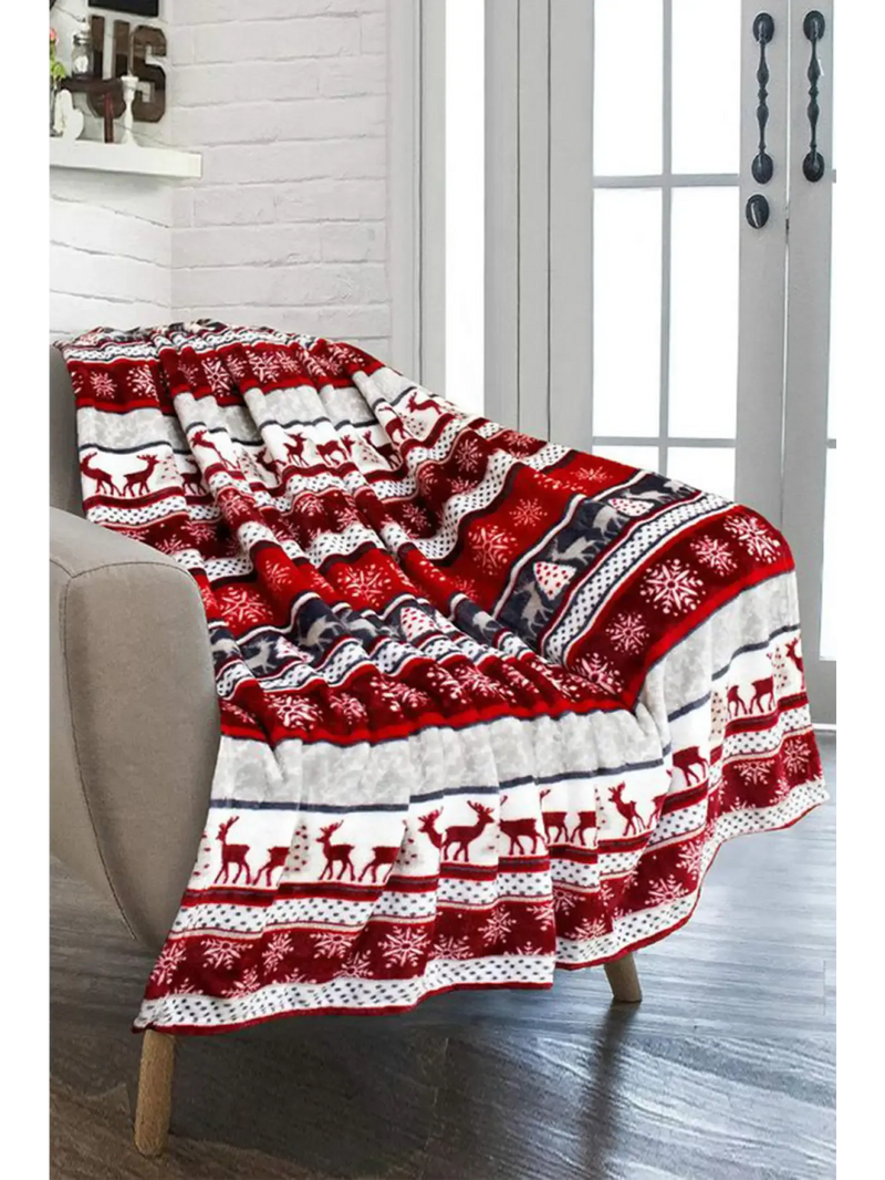 Trendy holiday gift ideas featuring a cozy red and white blanket with festive patterns for winter celebrations