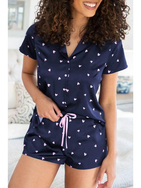 Cozy women's loungewear sets featuring soft navy top and shorts with heart print for stylish relaxation