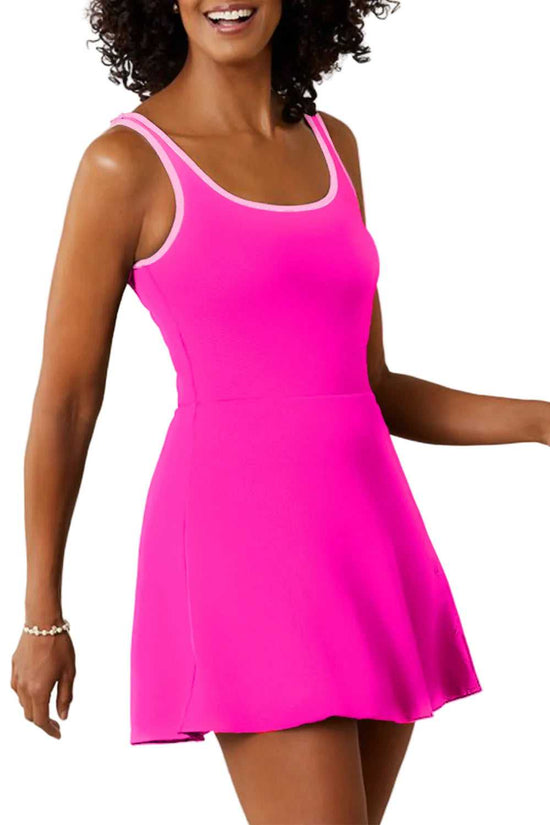 Swim dress with shorts for women in bright pink, featuring a modest one-piece design with scoop neckline and flared skirt. Ideal for beach or pool.