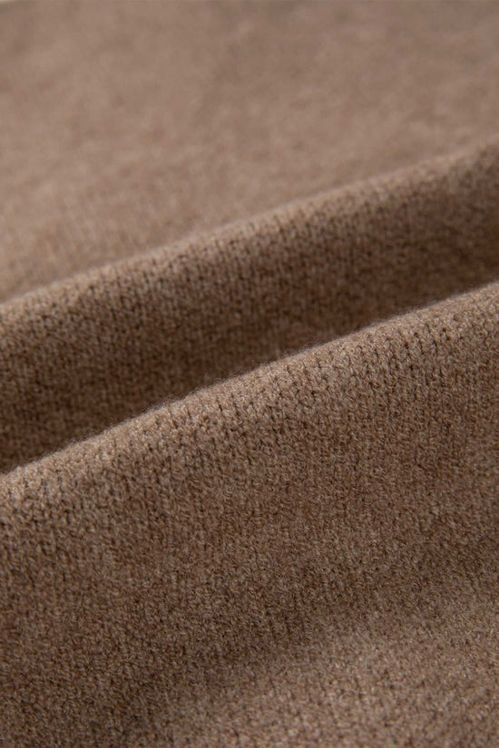 Fabric close-up of khaki knit cardigan showing soft, textured material. Perfect for cozy, smart-casual layering in cooler seasons.