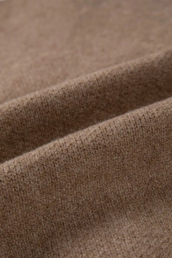 Fabric close-up of khaki knit cardigan showing soft, textured material. Perfect for cozy, smart-casual layering in cooler seasons.