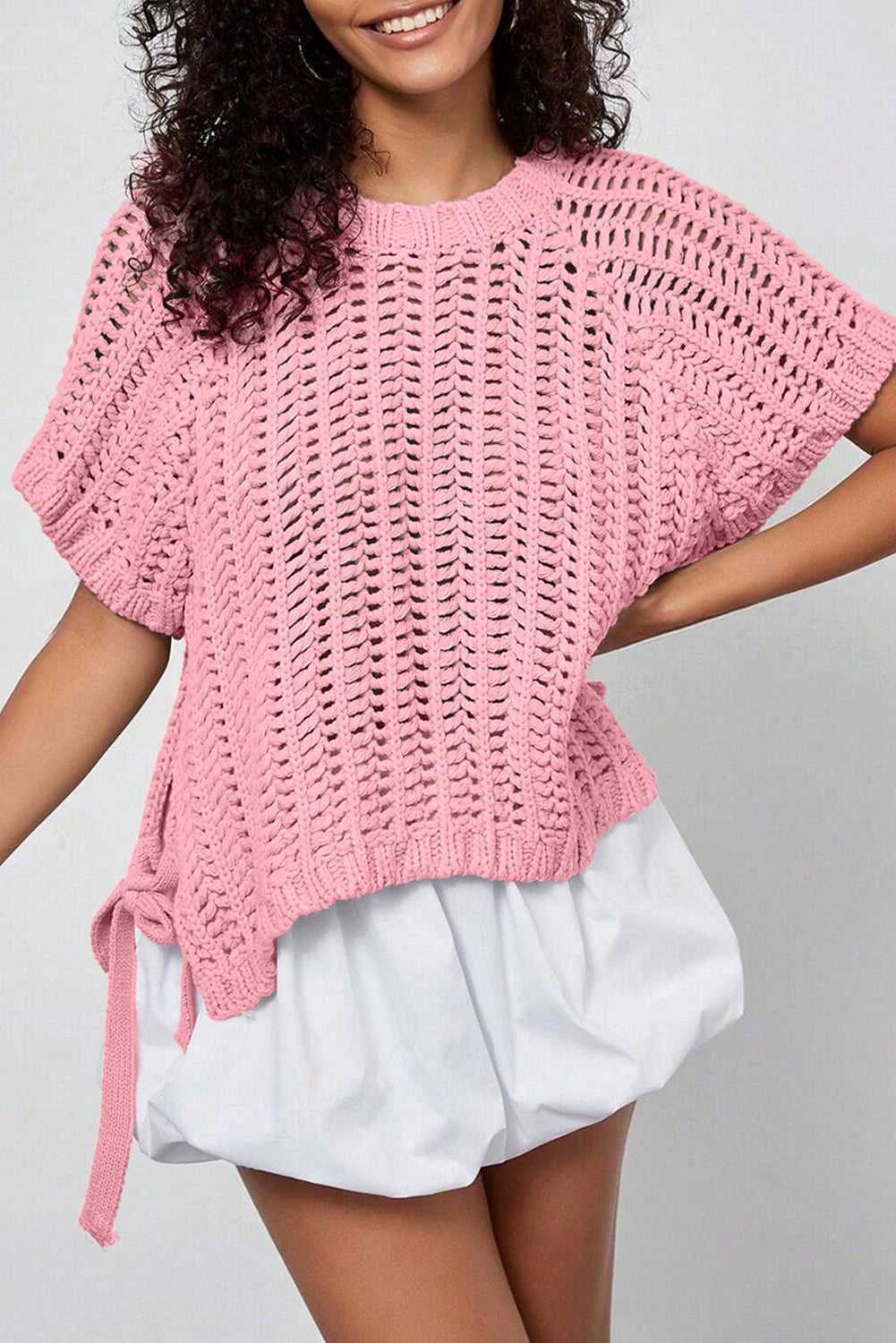 Plus Size Bow Tie Open‑Knit Jumper for Women in pink featuring short sleeves, open-knit design, and feminine bow tie.
