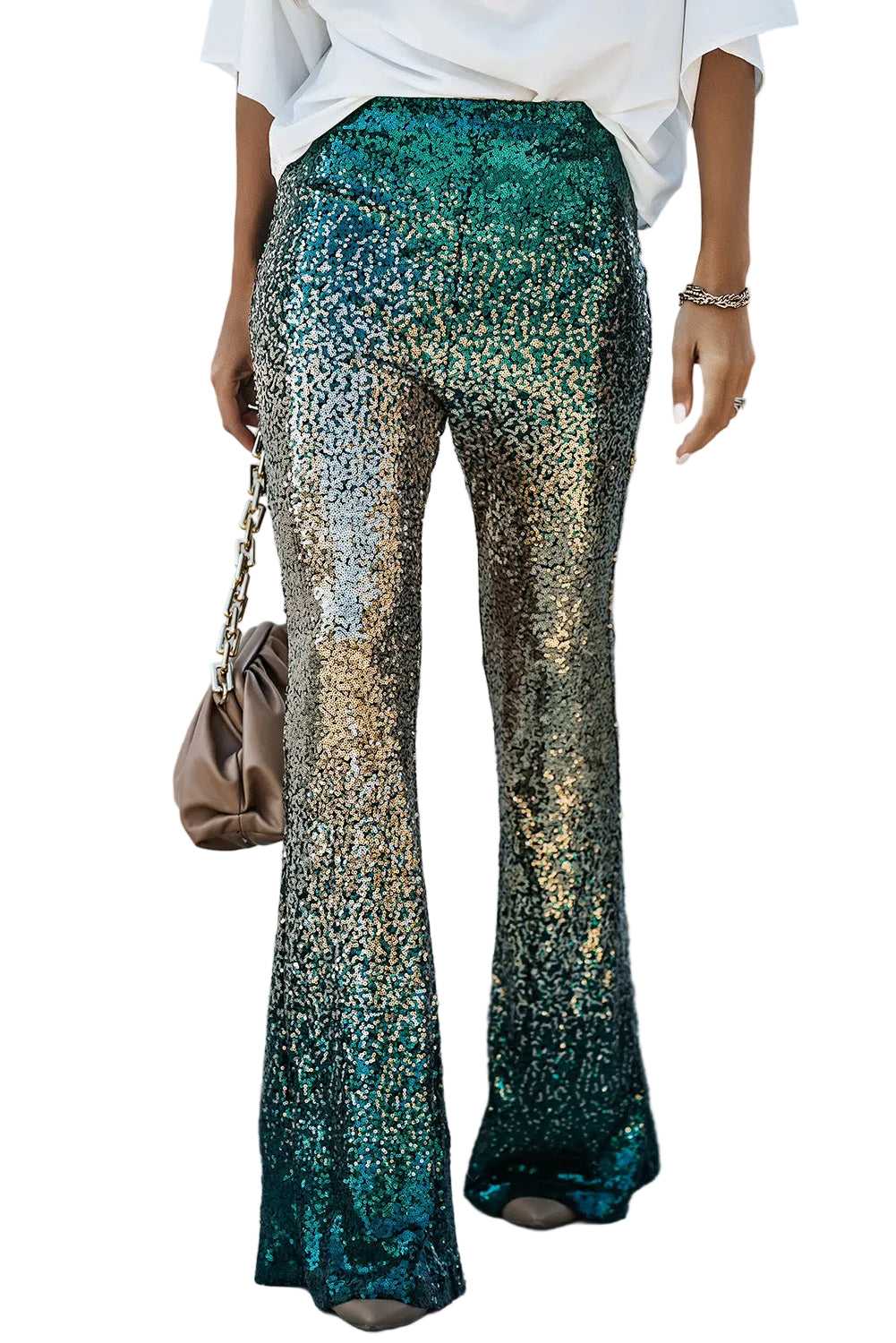 Green sequin flared trousers with gold gradient shimmer, styled for women’s party wear. Features elastic waist and medium stretch fit.