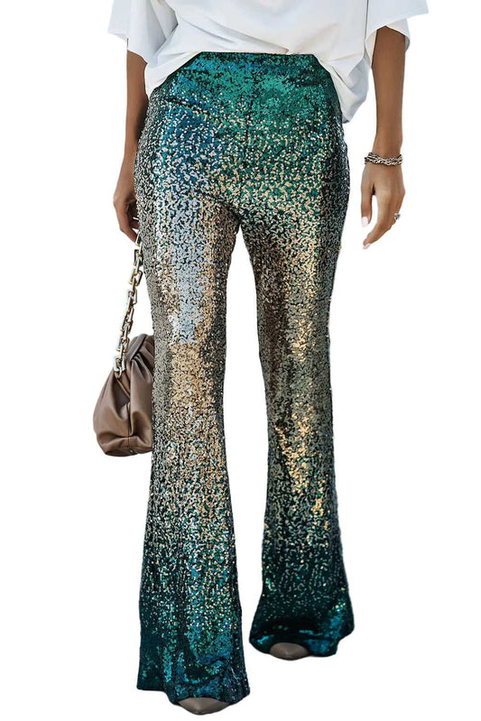 Green sequin flared trousers with gold gradient shimmer, styled for women’s party wear. Features elastic waist and medium stretch fit.