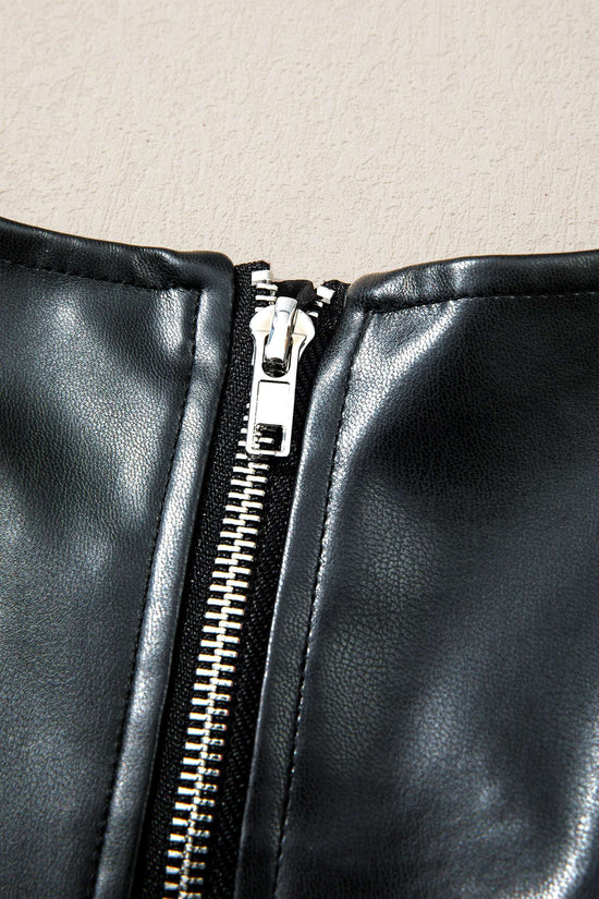 Detail of zipper on Ladies Black Faux Leather Mini Dress | FashionFitz showing silver hardware and clean stitching.