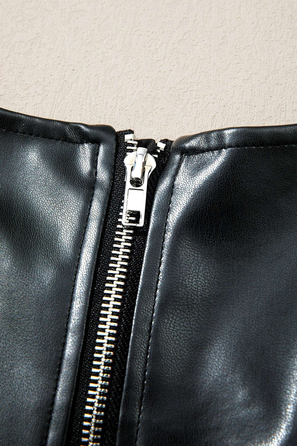 Detail of zipper on Ladies Black Faux Leather Mini Dress | FashionFitz showing silver hardware and clean stitching.