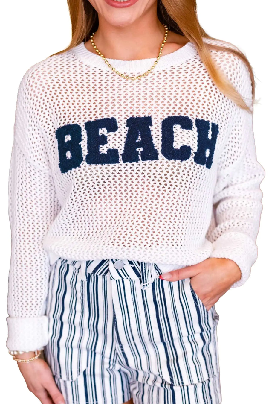 Hollow out crochet knit texture close-up on white chenille sweater — Fashionfitz UK
