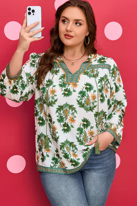 Woman wearing floral patchwork tassel tie 3/4 sleeve plus size blouse