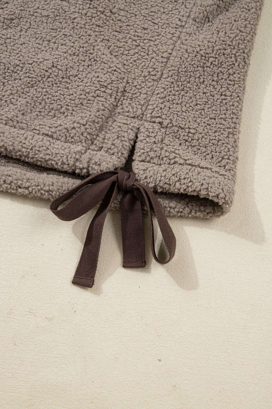 Close-up of brown ribbon bow tie at hem of Women's Country Borg Fleece Gilet Winter Vest FashionFitz, adding adjustable fit and charm.