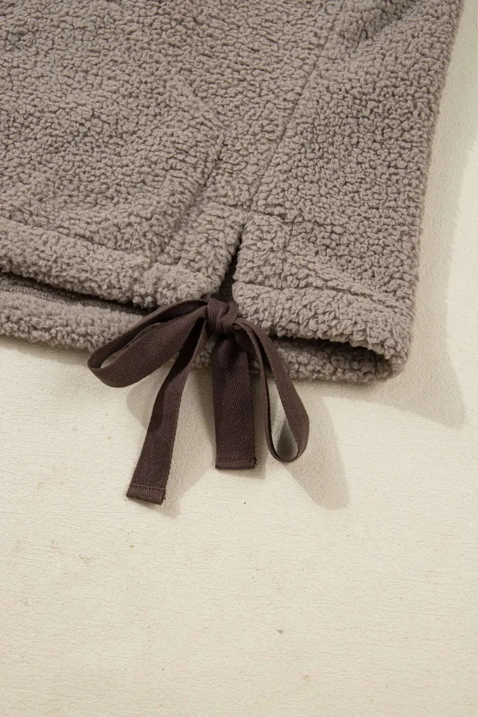 Close-up of side bow tie hem on Women's Country Borg Fleece Gilet Winter Vest FashionFitz showing sherpa texture and adjustable fit.