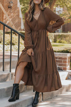 Brown version of Ladies Long Sleeve Tiered Maxi Dress styled with black boots, featuring button front and flowy silhouette.