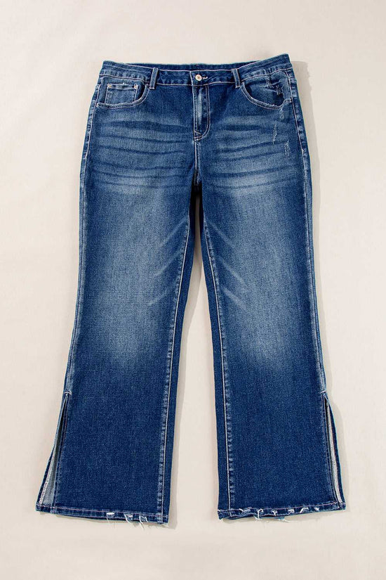 Flat lay of Dirty Blue Side‑Slit Flare Jeans – Curve displaying front design, flare legs, and side slits in solid blue denim.