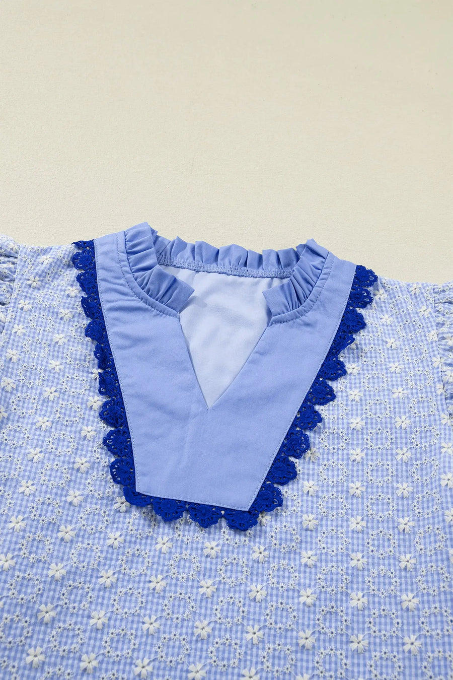 Eyelet embroidered flutter sleeve blouse with lace trim blouses