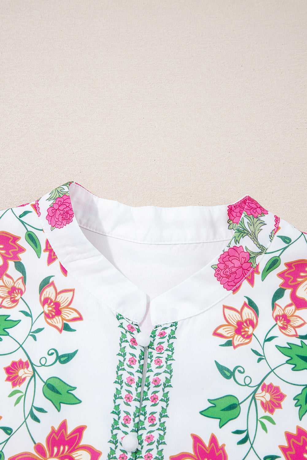 Close-up of mandarin collar on White Floral Mandarin Maxi Dress with intricate floral trim and soft neckline details.