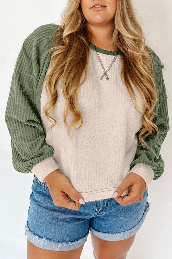Woman wearing waffle colorblock long sleeve plus size top